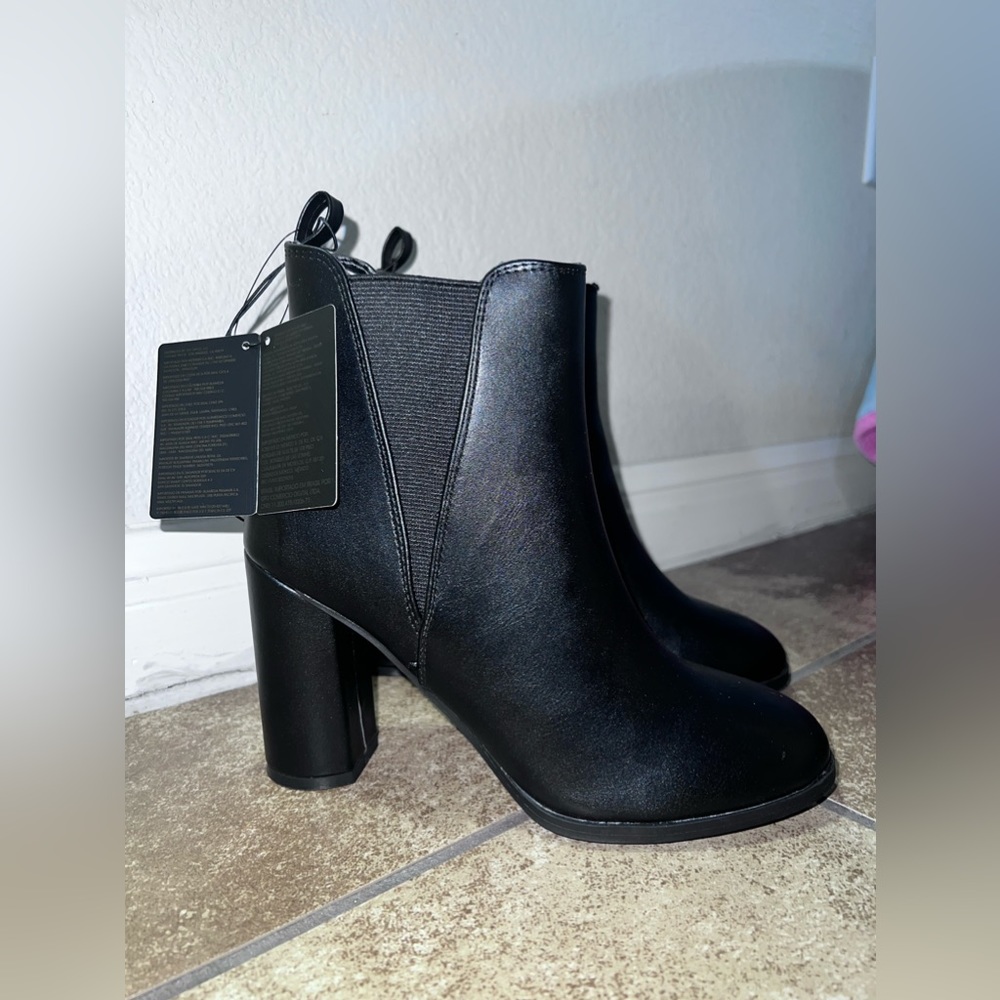 Black booties. Forever 21. Size 7. New with tags